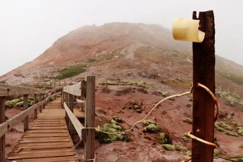 Rusty pole of a walkway on a mountain Stock Photos