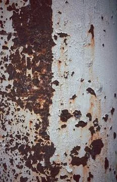 A rusty pole with a white stripe Stock Photos