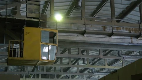 Rusty rail crane works in old factory, moves to warehouse to transfer products Stock Footage 115936028