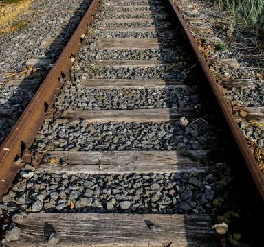 The rusty rails of a railway. Stock Photos