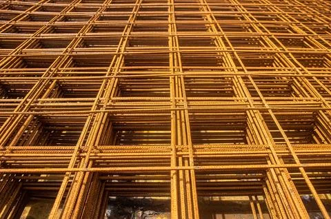 Rusty rebar grid used in construction for reinforcing concrete structures, .. Stock Photos