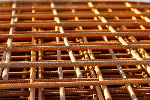 Rusty rebar mesh forming construction grid pattern Stock Photos