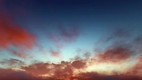 Rusty red magenta storm clouds blue sky dusk sunset time lapse seamless loop Video stock 159707094