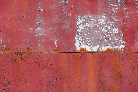 Rusty red painted flat sheet metal surface full-frame background and texture Фото