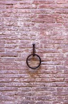 Rusty ring on adobe wall Stock Photos