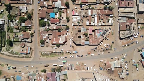 Rusty rooftops of African town Loitokitok in Kenya, aerial top down Stock Footage 279978557