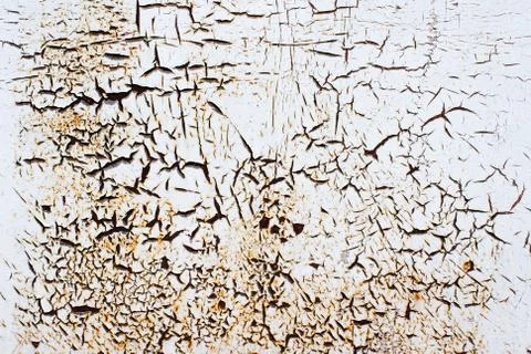 Rusty rough metal texture background with remnants of old white paints with c Stock Photos
