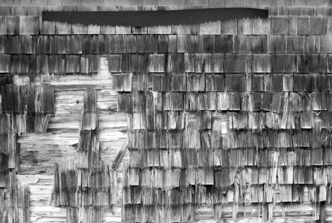 Rusty saw on barn wall Stock Photos