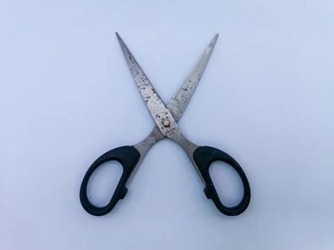 Rusty scissors with black handle Stock Photos