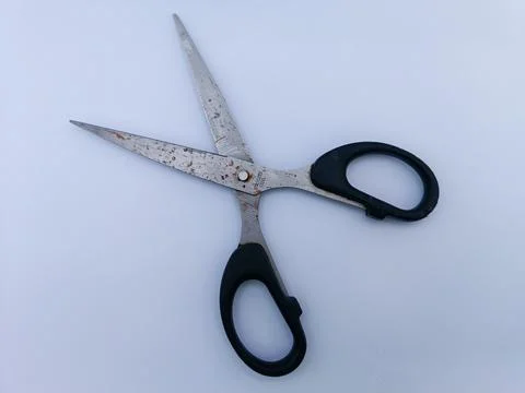 Rusty scissors with black handle Stock Photos