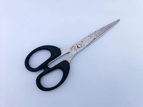 Rusty scissors with black handle Stock Photos