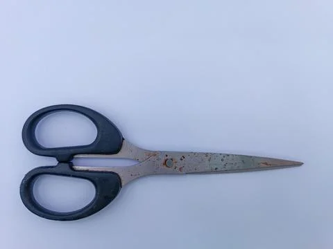 Rusty scissors with black handle Stock Photos