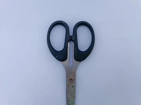 Rusty scissors with black handle Stock Photos