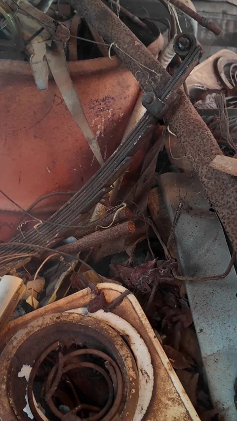 Rusty Scrap Metal, 4k Vertical Video Industrial Waste Smoke Slider Right to Left Stock Footage 323734379