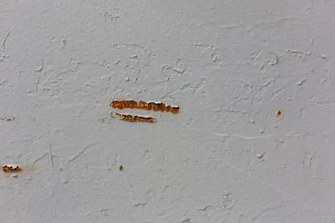 A rusty scratch on the wall pattern texture background Stock Photos