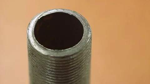 Rusty screw tube spinning Stock Footage 74849657