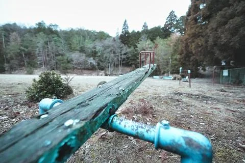 Rusty Seesaw in an Empty Playground – Time Stretching into Silence Stockfoto's