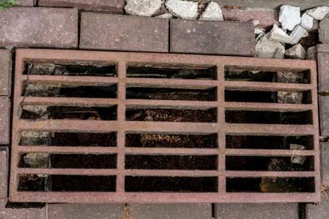 Rusty sewer grate, top view. Stock Photos