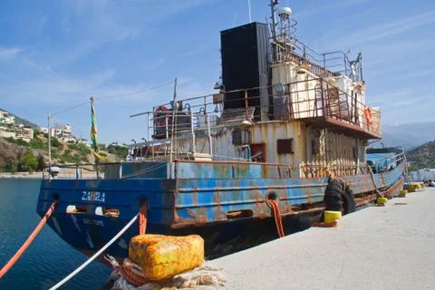 Rusty ship in harbor Stock Photos