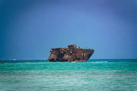 Rusty ship in the middle of the ocean Stock Photos