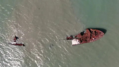 A rusty ship is at sea after the crash. the coast of Sakhalin Island. the city Stock Footage 232879158