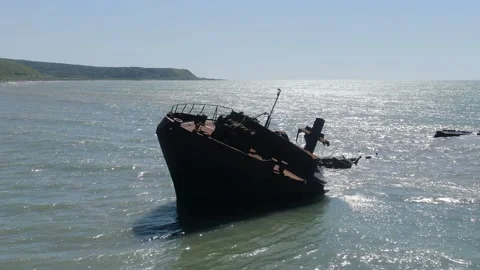 A rusty ship is at sea after the crash. the coast of Sakhalin Island. the city Stock Footage 232879179