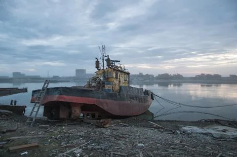Rusty ship on the shore Stock Photos