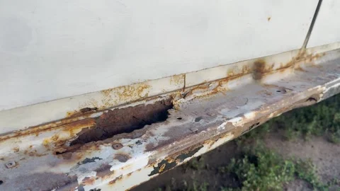 Rusty sills of an old white car with holes Stock Footage 280498717