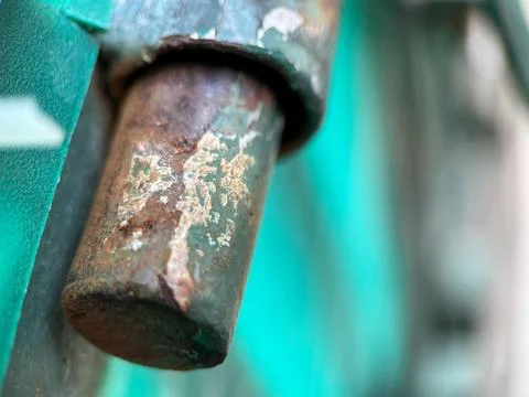 Rusty sliding lock made from iron metal with blurred background Stock Photos