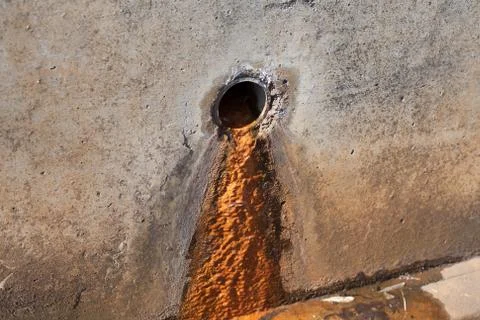 Rusty sludge from a drain pipe Stock Photos