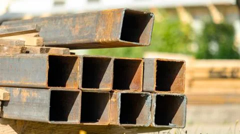 Rusty square pipes on a construction site Stock Photos