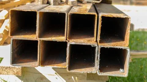 Rusty square pipes on a construction site 스톡 사진