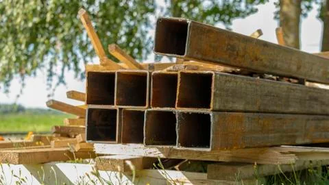 Rusty square pipes on a construction site Stock Photos