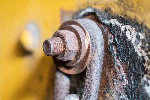 Rusty srew and nut closeup connected with rusted chain - Stock Photos