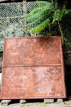 Rusty stand and palm tree. Stock Photos