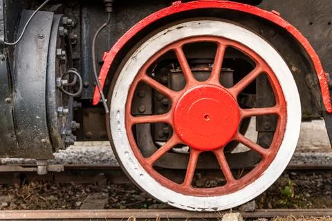 Rusty steam train wheel showing intricate details from an old locomotive in a Stock Photos