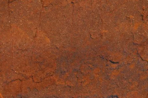 Rusty stone texture. Abstract dark orange pattern. Stock Photos