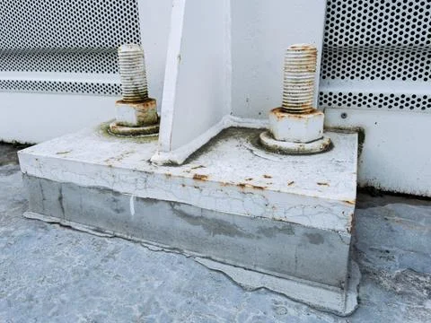 Rusty Structural Bolts on a Concrete Foundation Stock Photos