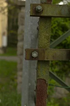 Rusty support column exhibiting paint flaking and structural concerns Stock Photos