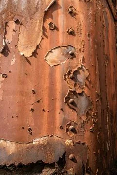 Rusty surface details of an old steam train revealed in a close-up shot Stock Photos
