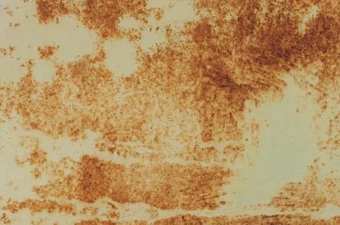 A rusty surface with a few spots of paint 스톡 사진