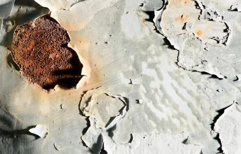Rusty surface of iron doors, crackled paint. Stock Photos