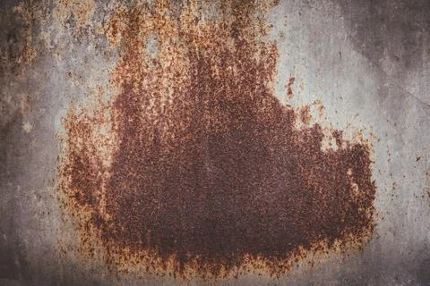 A rusty surface with a large hole in the middle Stock Photos