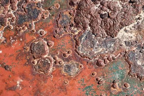 Rusty surface with many small holes - background old vintage rugged old Stock Photos