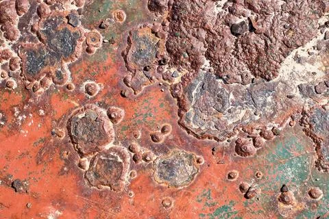 Rusty surface with many small holes - background old vintage rugged old Stock Photos