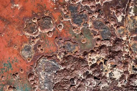 Rusty surface with many small holes - background old vintage rugged old Фото