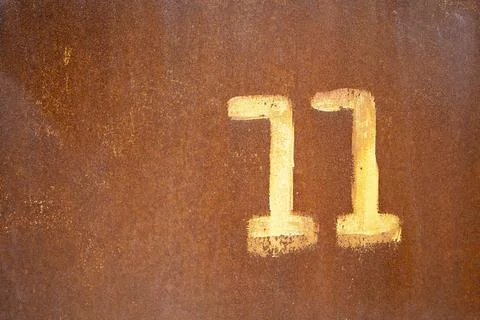 On the rusty surface in paint is written 11 Stock Photos
