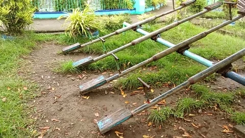 Rusty swing in the park Stock Footage 323465556