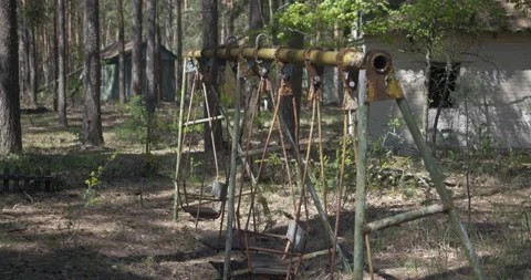 Rusty swing set abandoned village Stock Footage 200947784