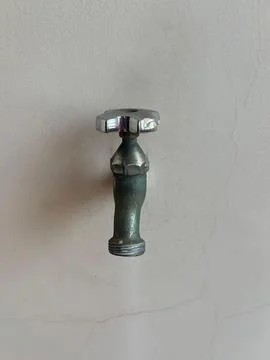 Rusty tap on the wall Stock Photos